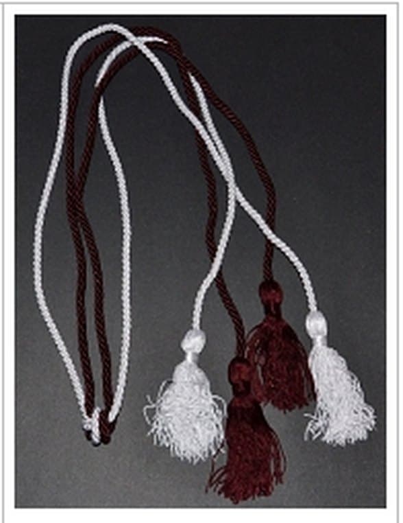 Maroon and white graduation honor cords with tassels.